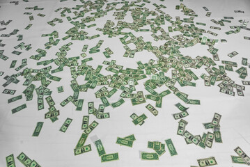 floor full of dollars bills