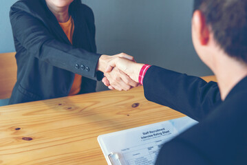 Business people job interview by HR officer shaking hands in office smiling face with happiness....