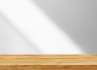 Empty wooden table with light and shadow on white wall