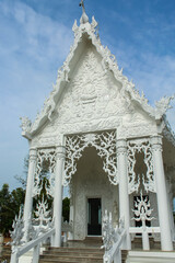 Close up on the White temple with sky background in Kanchanaburi, Thailand