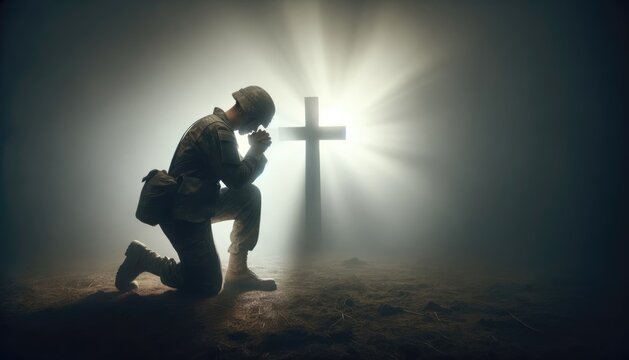 A poignant scene of a soldier in uniform kneeling in solemn prayer beside a rugged cross on a misty battlefield.