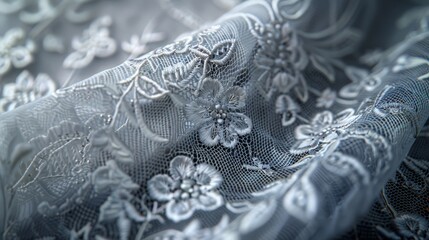 Delicate floral lace fabric draped, highlighting its intricate patterns. - obrazy, fototapety, plakaty