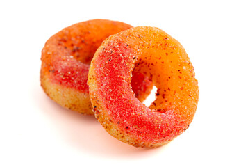 Peach Gummy Fruit Rings Covered in Chili Lime Seasoning Isolated on a White Background