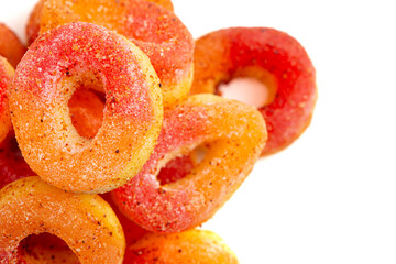 Peach Gummy Fruit Rings Covered in Chili Lime Seasoning Isolated on a White Background