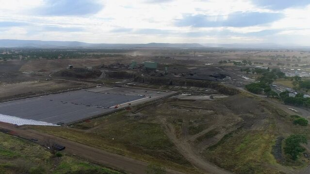 Drone over mine site at dawn waste disposal
