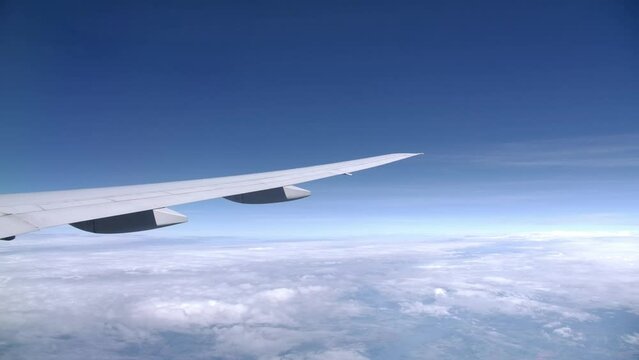 Long Slick Airplane Wing in Flight, Passenger View from the Window