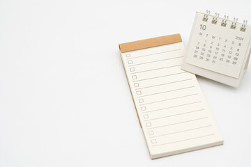 Blank Check list or Empty small notepad for text with checkbox and Simple desk calendar for OCTOBER 2024. Blank to do list for text in OCT. Copy Space.