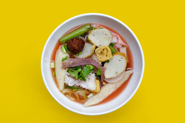 A bowl of pink flat noodles