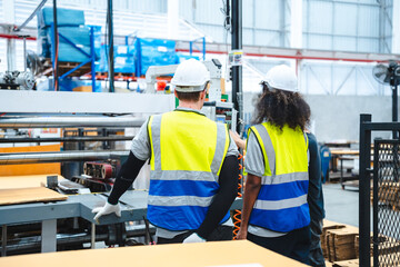 professional business industry technician wearing safety helmet working to maintenance service and checking factory equipment, a work of engineer occupation in manufacturing construction technology