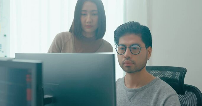 Group Adult Asia male, female freelance meeting write prompt AI bot IT app smart program nomad, video game, talk strategy, discuss plan, user interface, designer, big data center on desktop computer.