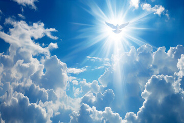 religion, présence de Dieu, le divin symbolisé par une colombe blanche entourée par les rayons du soleil, dans un ciel bleu aux nuages blancs. Icone des religions judéo chrétiennes. Saint Esprit,
