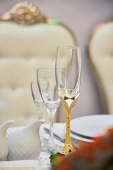 Festive drinks glasses for the newlyweds. The wedding table