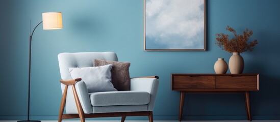 Armchair placed against a blue wall with artwork in a cozy living room setting.