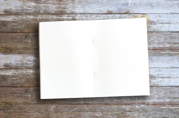 Top view with blank notebooks on wood table background