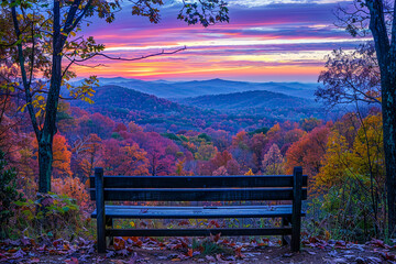A scenic overlook where an empty bench faces a valley awash in the fluorescent colors of nature offering a view that captures the imagination