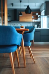 Blue chair sits in front of wooden table