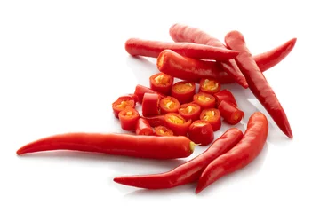 Foto op Canvas Sliced red hot chili peppers and Red chilli pepper isolated on a white background © kaiskynet