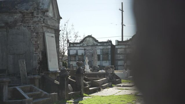 Dilapidated graves within Lafayette Cemetery #2 in New Orleans, Louisiana on a sunny, cold winter day. 