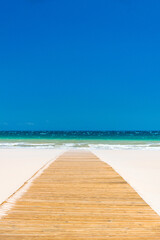 Path to Paradise: Wooden Boardwalk on Pristine Beach