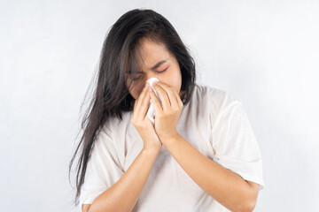 Young beautiful asian woman got sick and flu on white background.