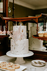 White wedding cake on display for reception