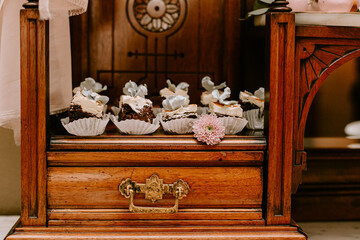 Wedding Cake treats in wooden display shelf