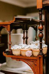 Fototapeta na wymiar Vanilla wedding cupcakes on sweet treat table