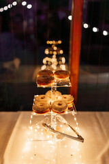 fun donut display at night reception for wedding