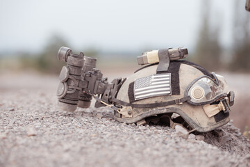 A military helmet complete with night vision goggles.