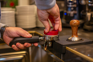 Fototapeta na wymiar Professional barista preparing perfect cappuccino in the cafe bar