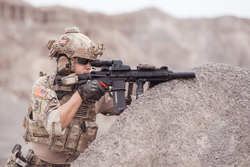 Soldiers in camouflage military uniforms carrying weapons, Reconnaissance missions in rugged...