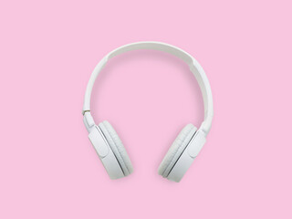 White headphone pink background.