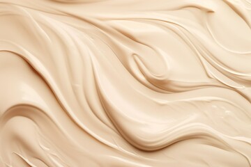 Abstract cosmetic background, beige waves of cream or ointment smeared on the surface. Plastic soft...