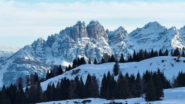 Civetta resort. Panoramic view of the Dolomites mountains in winter, Italy. Ski resort in Dolomites, Italy. Aerial drone view of ski slopes and mountains in dolomites.