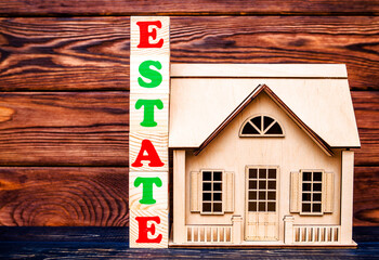 Wooden home and text on the cubes estate
