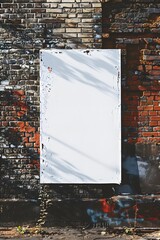 Blank poster on a brick wall setup.