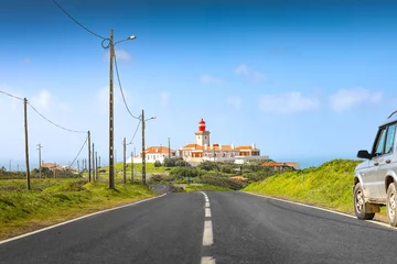 Papier Peint photo Atlantic Ocean Road The road to Cabo da Roca lighthouse. Travel to this amazing landscape landmark from Portugal at Atlantic Ocean shore.