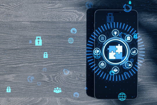 Close up of smartphone with creative round data management hologram with jigsaw puzzle on wooden desk background. Data, business hud and cloud concept.