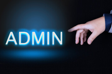 ADMIN text is a word written in neon letters on a black background pointed to by a hand with a person's index finger.