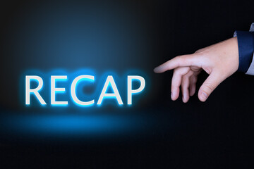 RECAP text is a word written in neon letters on a black background pointed to by a hand with a...