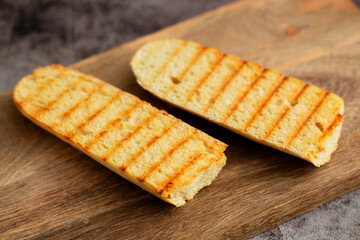 Two pieces of bread with grill marks on them