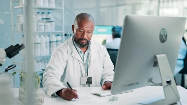 Science, writing and black man with plants, computer for research and report on medical engineering. Biotech, botany and leaves, scientist or lab technician with notes for online review in agro study