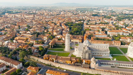 Pisa, Italy. Famous Leaning Tower and Pisa Cathedral in Piazza dei Miracoli. Summer. Morning hours,...