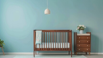 A baby crib in a room with soothing blue walls - obrazy, fototapety, plakaty