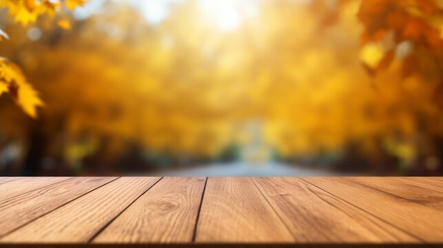 An empty brown wooden countertop on a blurred autumn horizontal background on a sunny day. Layout, Template for Product presentation, Advertising, Copy space.