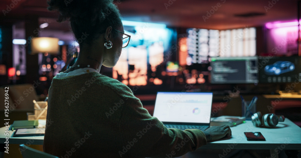 Aufkleber Backview: Motivated Black Female Using Laptop Computer in Creative Agency in the Evening, Manager Working on Implementing Business Strategy for Client. Specialist Writing Project Plans 