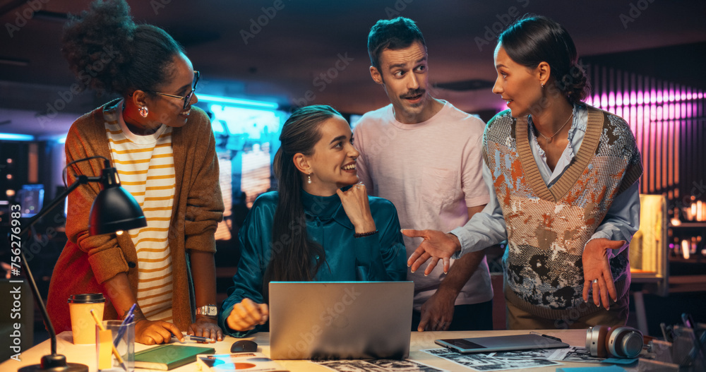 Poster Energetic Teammates Brainstorming For Marketing Strategy in a Creative Office at Night. Multiethnic Group of People Working on Developing Growth Ideas Based on Data Using Laptop Computer