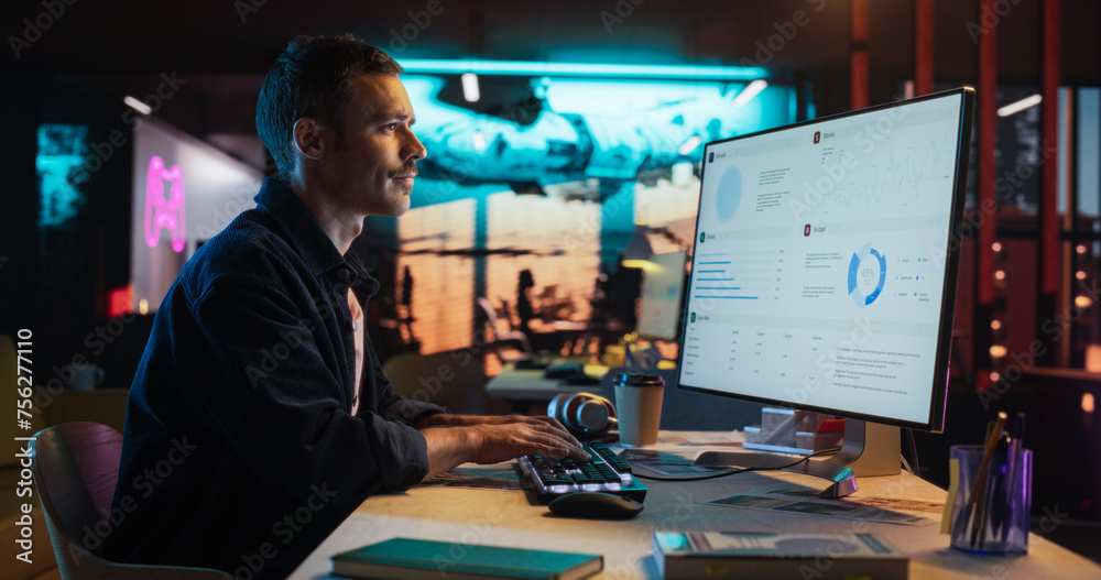Leinwandbilder portrait of professional male developer using desktop computer and typing in creative office. caucas