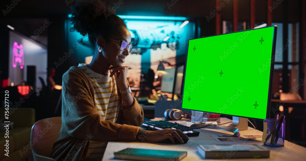 Poster Portrait of Black Female Working in Creative Agency, Implementing Modern Business Strategy for Clients. Successful Specialist Using Desktop Computer with Green Screen Mock Up Display