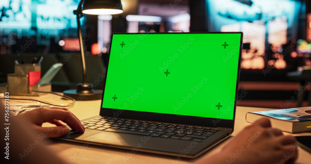 Poster Anonymous Designer Working on a Laptop Computer with Mock Up Green Screen Chromakey Display with Isolated Placeholder. Video Template for Artistic Content Creation and Presentations